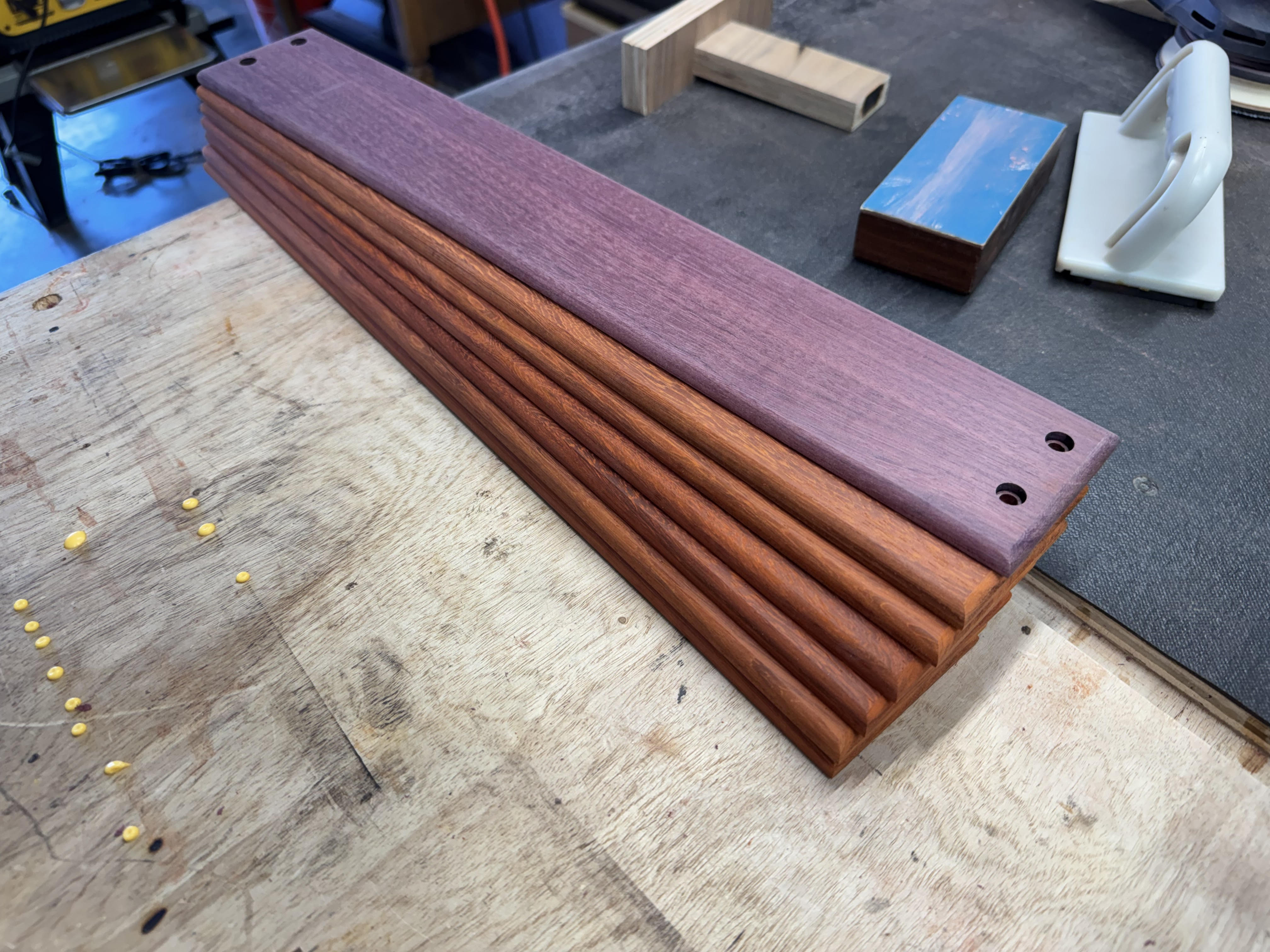 Purpleheart faceplate option on a warm wood enclosure body
