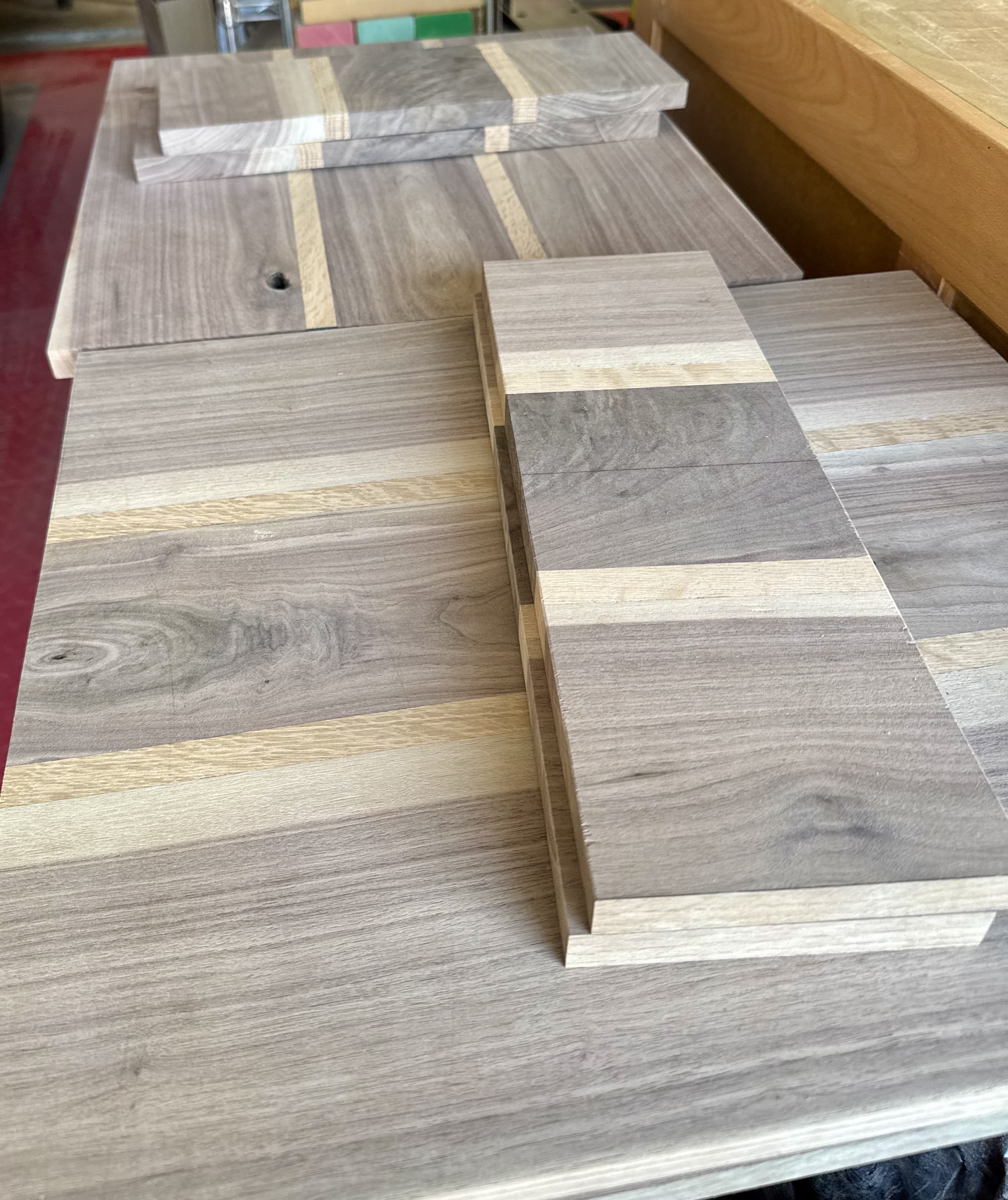 Solid walnut boards selected for audio enclosure work