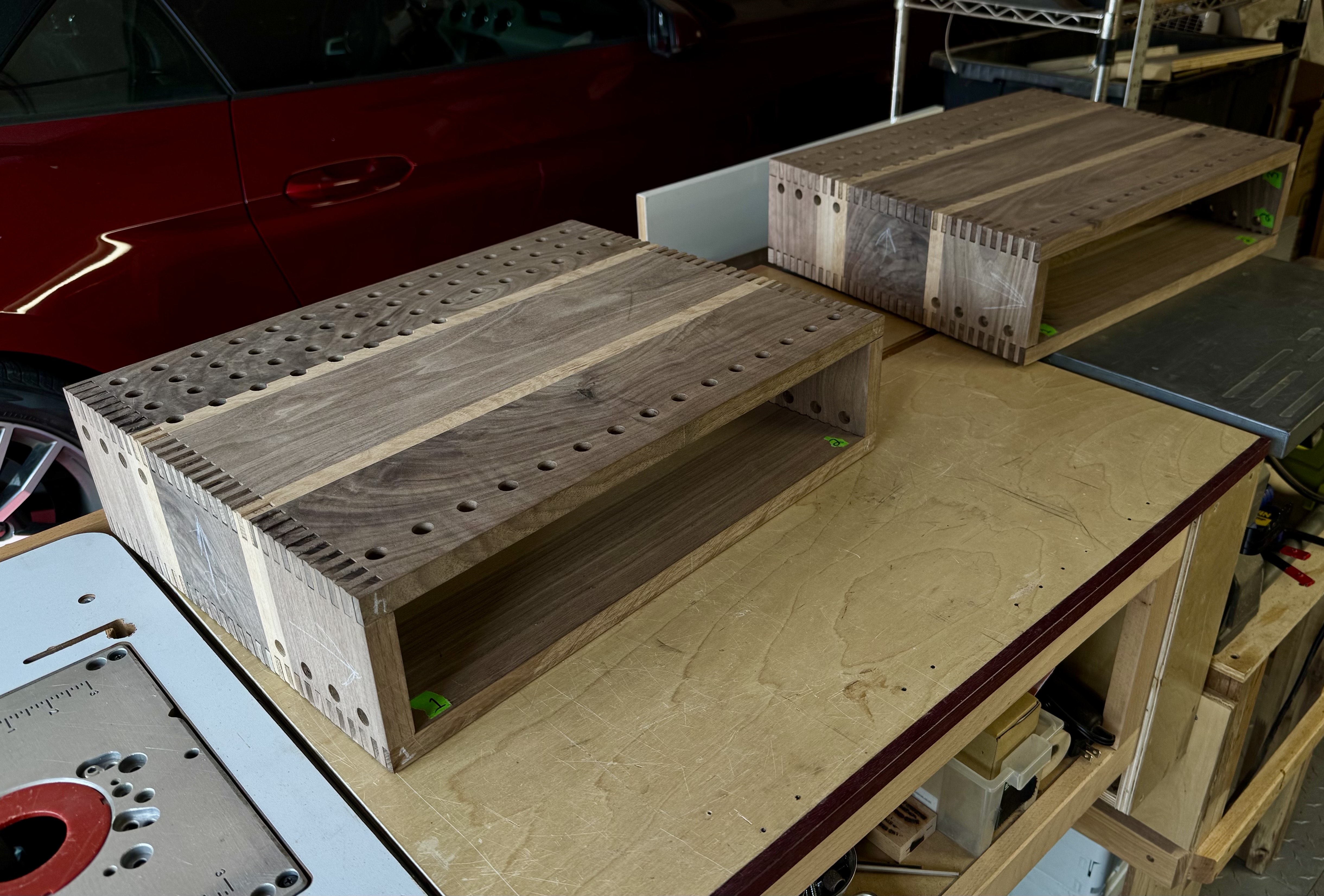 Hand-built walnut audio enclosures in progress with ventilation and joinery details