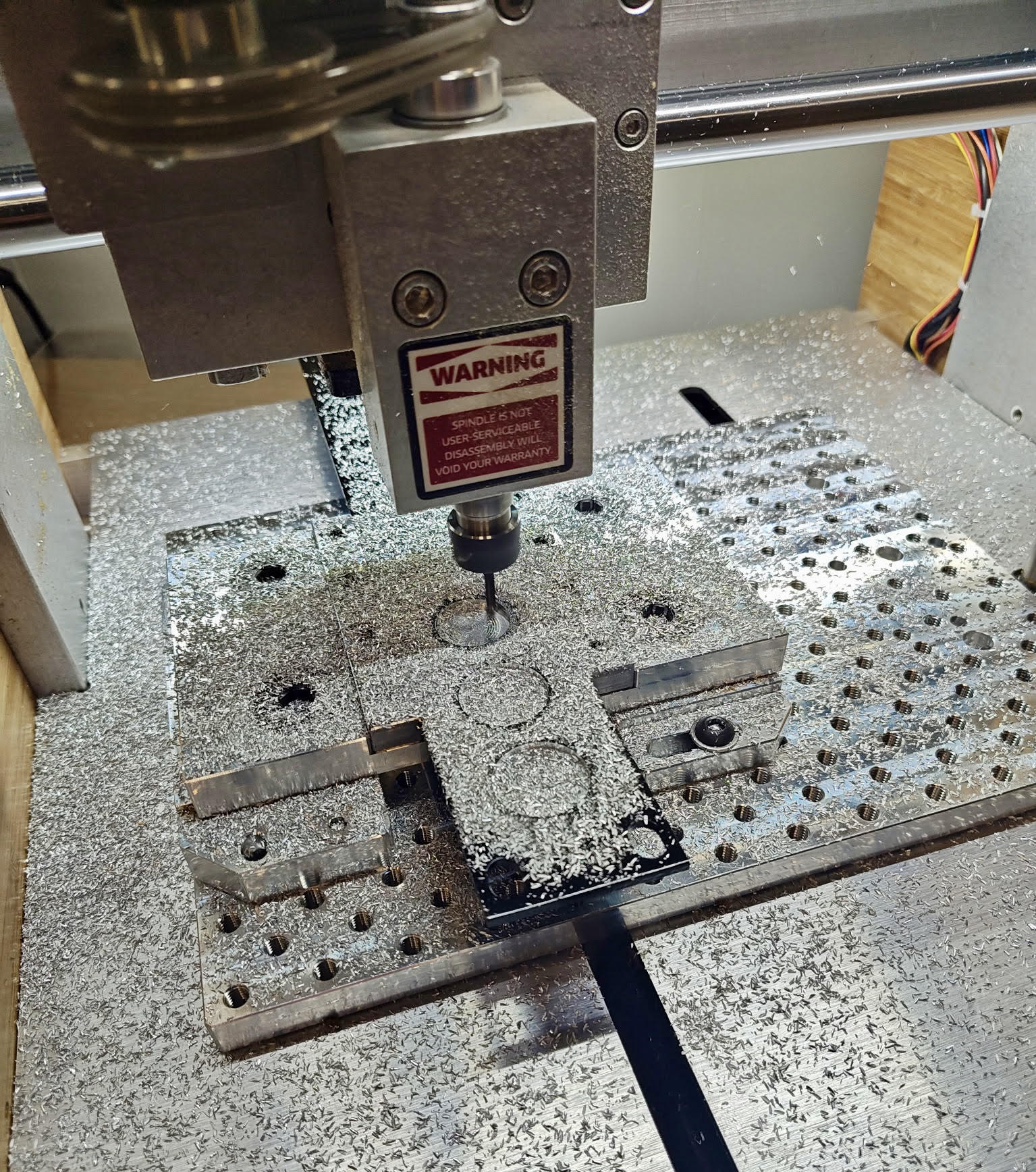 I/O panel machining in progress